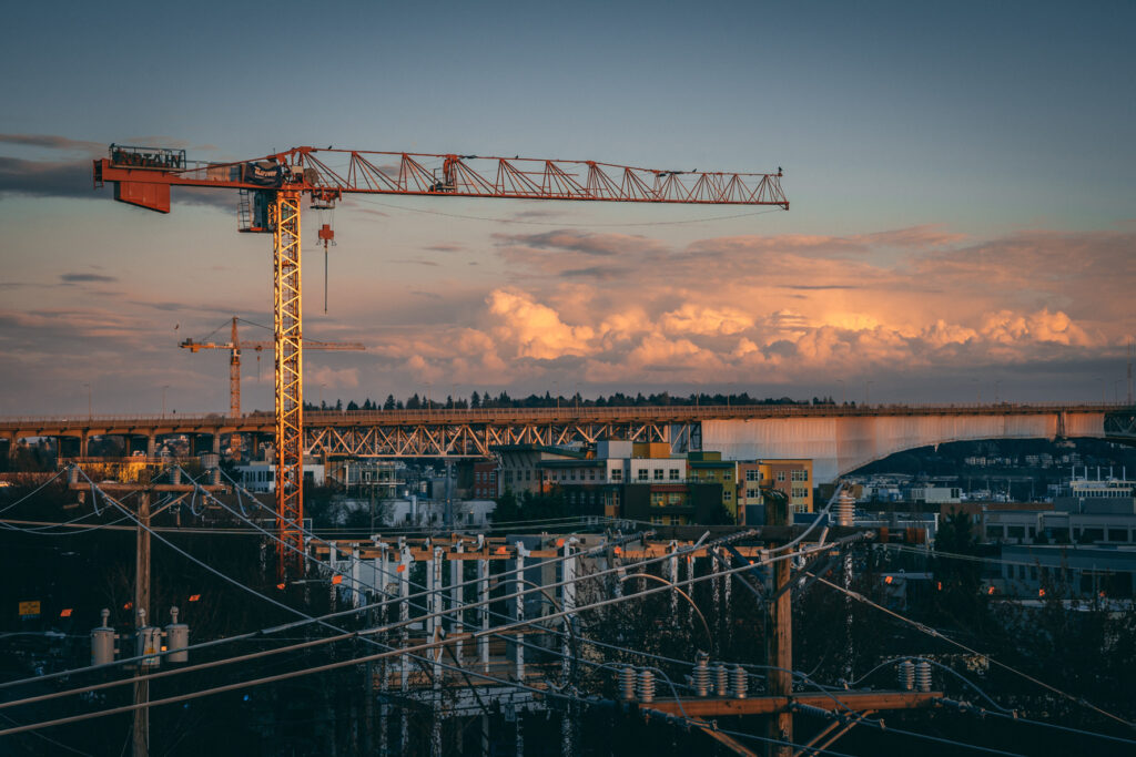 beautiful view of a construction site in a city during sunset 